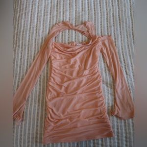 Oh Polly pink mini dress with mesh flare long sleeves and cut out details.